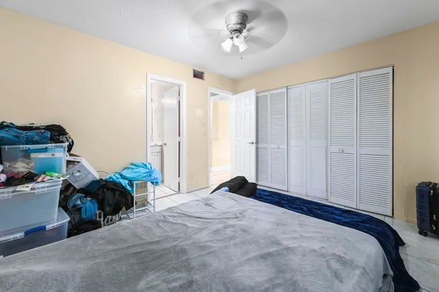 a bed room with a bed and a chandelier