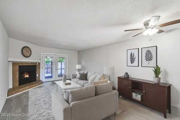 a living room with furniture and a fireplace