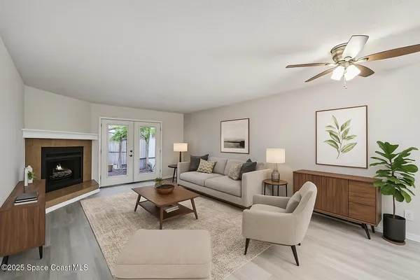 a living room with furniture and a fireplace