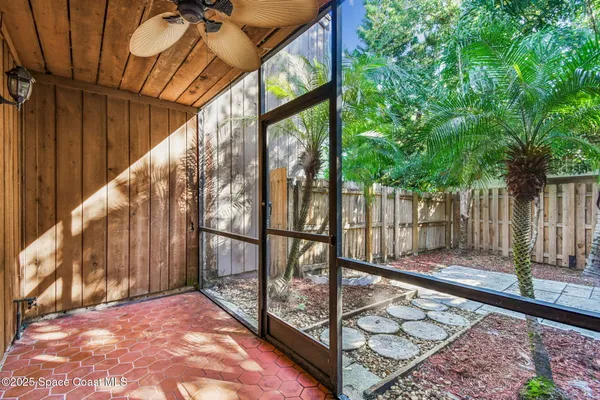 a view of a balcony with wooden floor