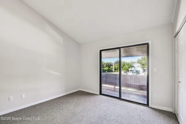 a view of a bathroom with closet area