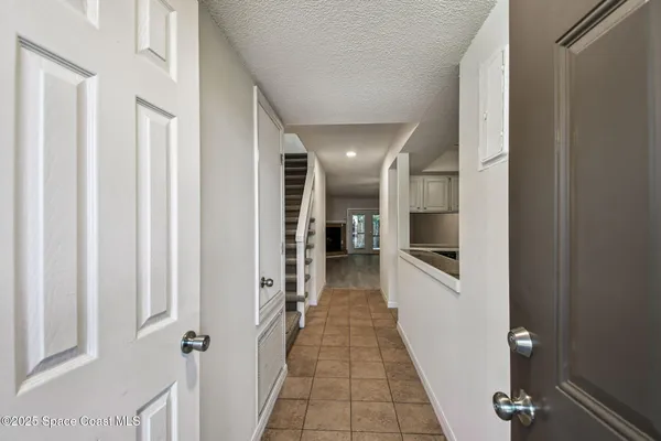 a kitchen with stainless steel appliances granite countertop a refrigerator a stove and a microwave oven