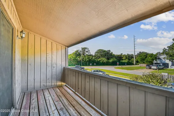 an aerial view of residential houses with outdoor space and swimming pool