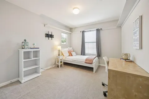 a bedroom with a bed and a cabinets