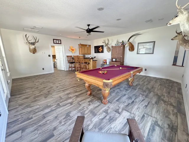 a spacious bedroom with a bed and a table