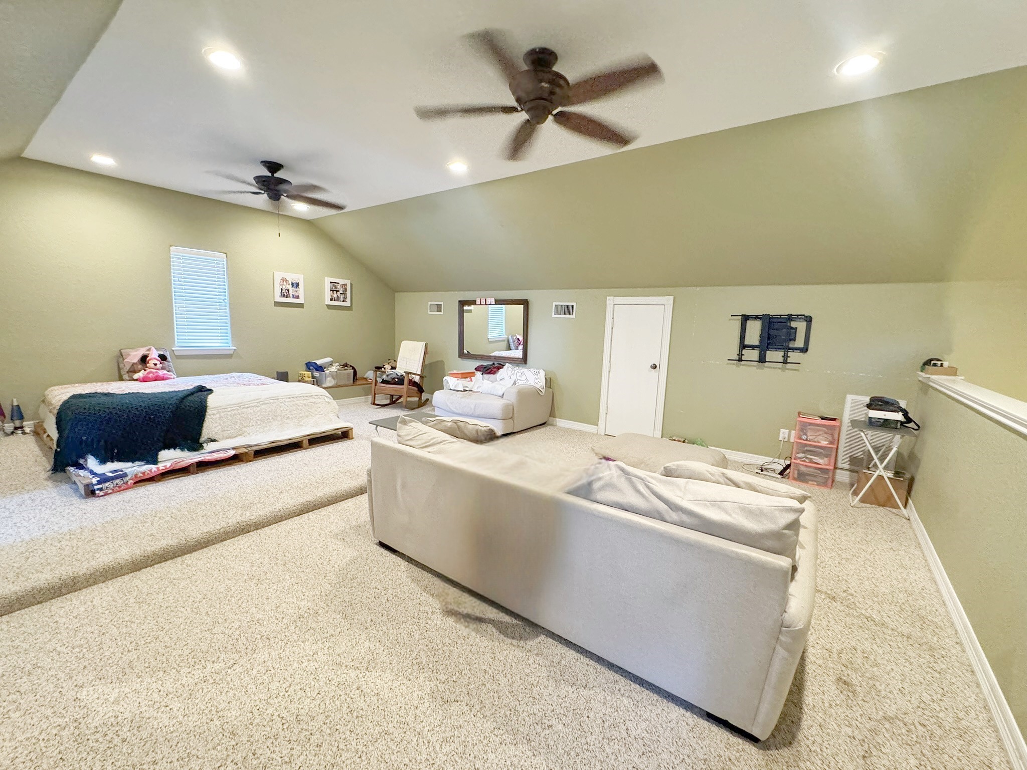 814 Sunset Trail Angleton, TX 77515 - Photo 15 of 26 a room with a bed and a chandelier