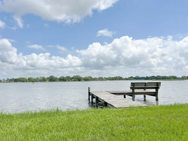 a swimming pool with wooden fence