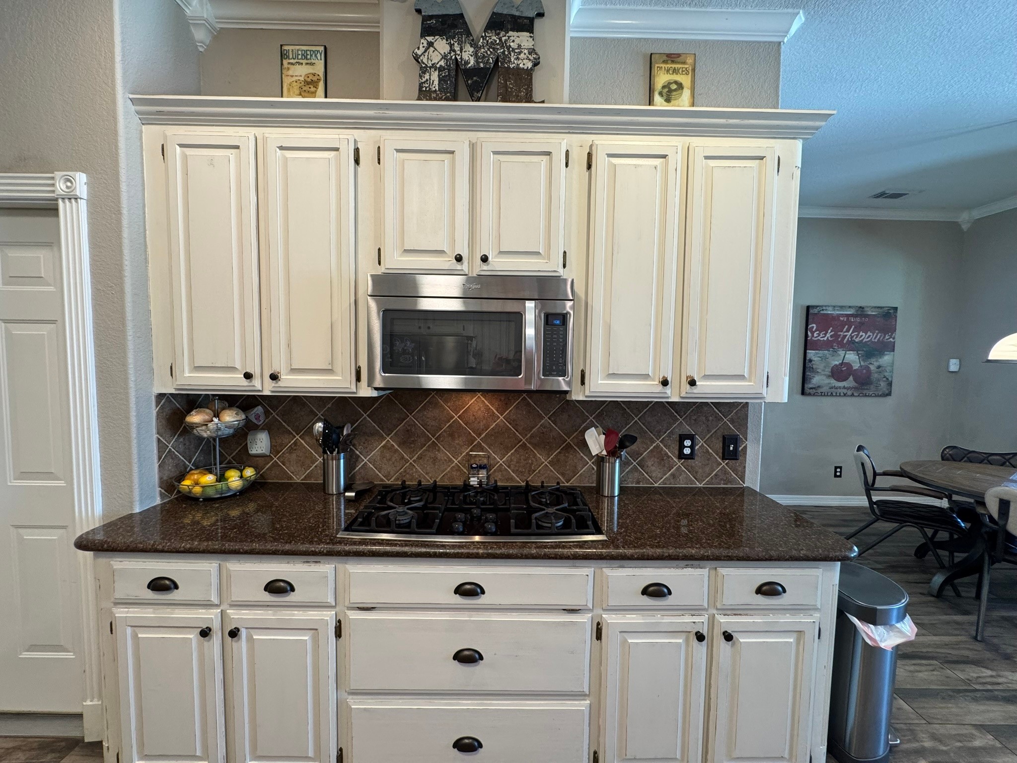814 Sunset Trail Angleton, TX 77515 - Photo 4 of 26 a kitchen with stainless steel appliances granite countertop a stove and a microwave
