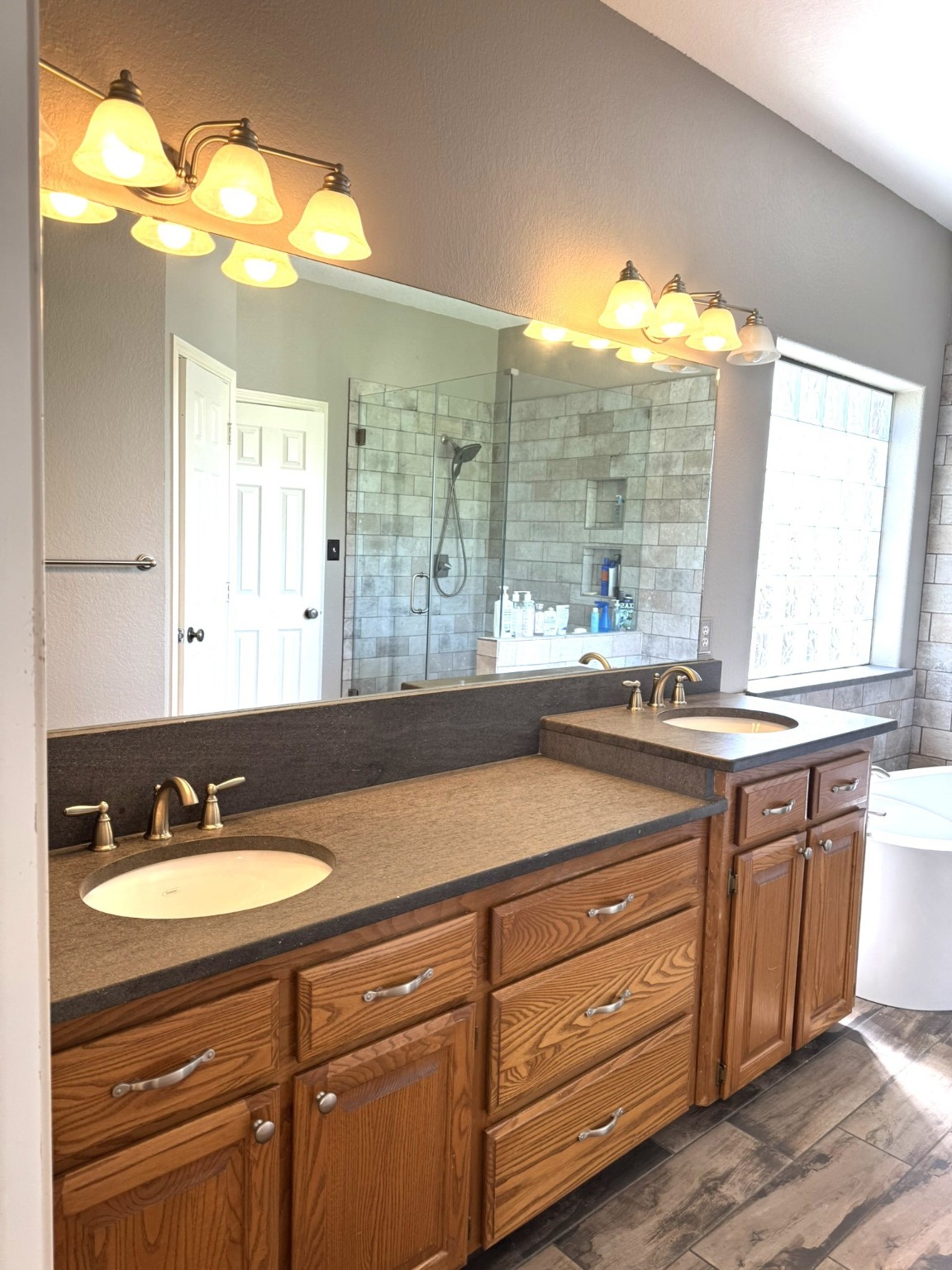 814 Sunset Trail Angleton, TX 77515 - Photo 8 of 26 a bathroom with a sink double vanity and a mirror