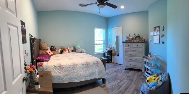 a bed room with a bed and a desk