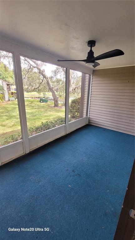 12025 Proctor Loop, Unit 1 New Port Richey, FL 34654 - Photo 11 of 11 a view of an empty room with a window