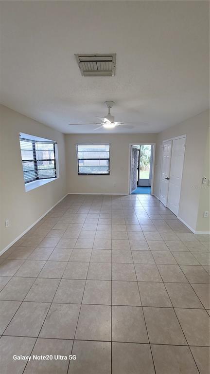 12025 Proctor Loop, Unit 1 New Port Richey, FL 34654 - Photo 2 of 11 a view of an empty room with windows