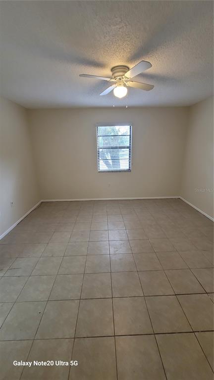 12025 Proctor Loop, Unit 1 New Port Richey, FL 34654 - Photo 8 of 11 a view of an empty room with a window