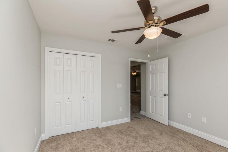 3931 Poverty Creek Road Crestview, FL 32539 - Photo 18 of 34 an empty room with closet and fan