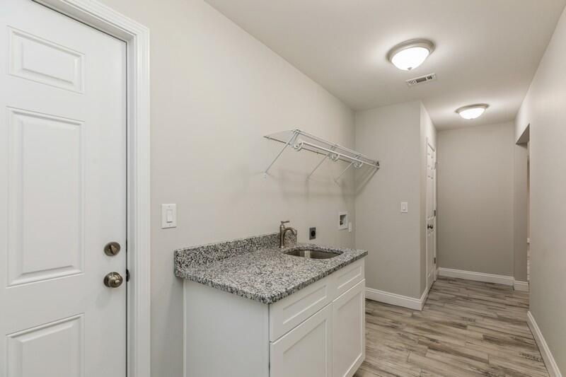 3931 Poverty Creek Road Crestview, FL 32539 - Photo 24 of 34 a bathroom with a granite countertop sink and a mirror