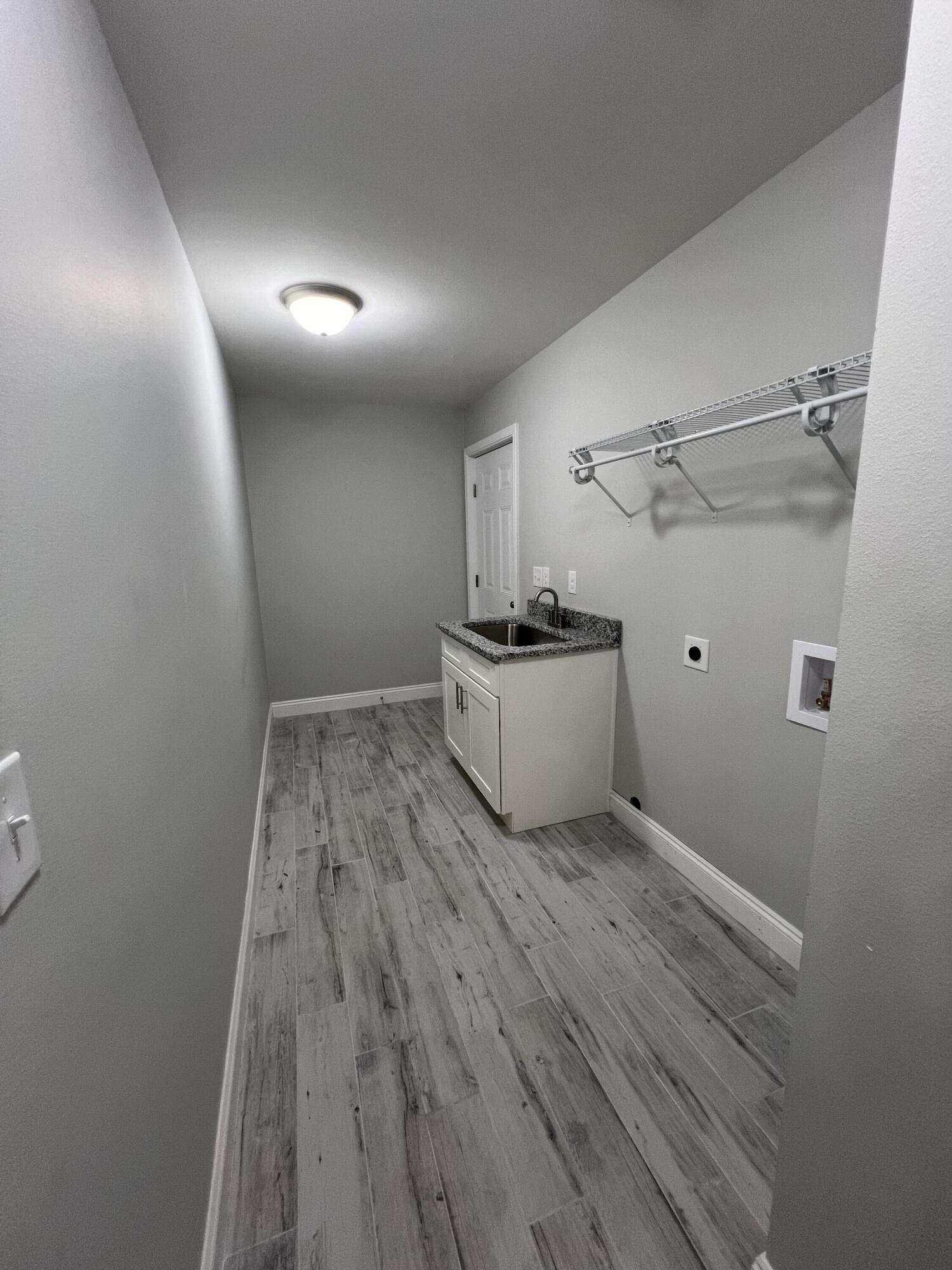 3931 Poverty Creek Road Crestview, FL 32539 - Photo 25 of 34 a view of a room with wooden floor