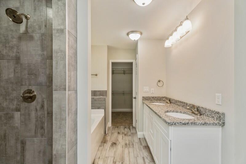 3931 Poverty Creek Road Crestview, FL 32539 - Photo 27 of 34 a bathroom with a granite countertop sink a mirror and shower