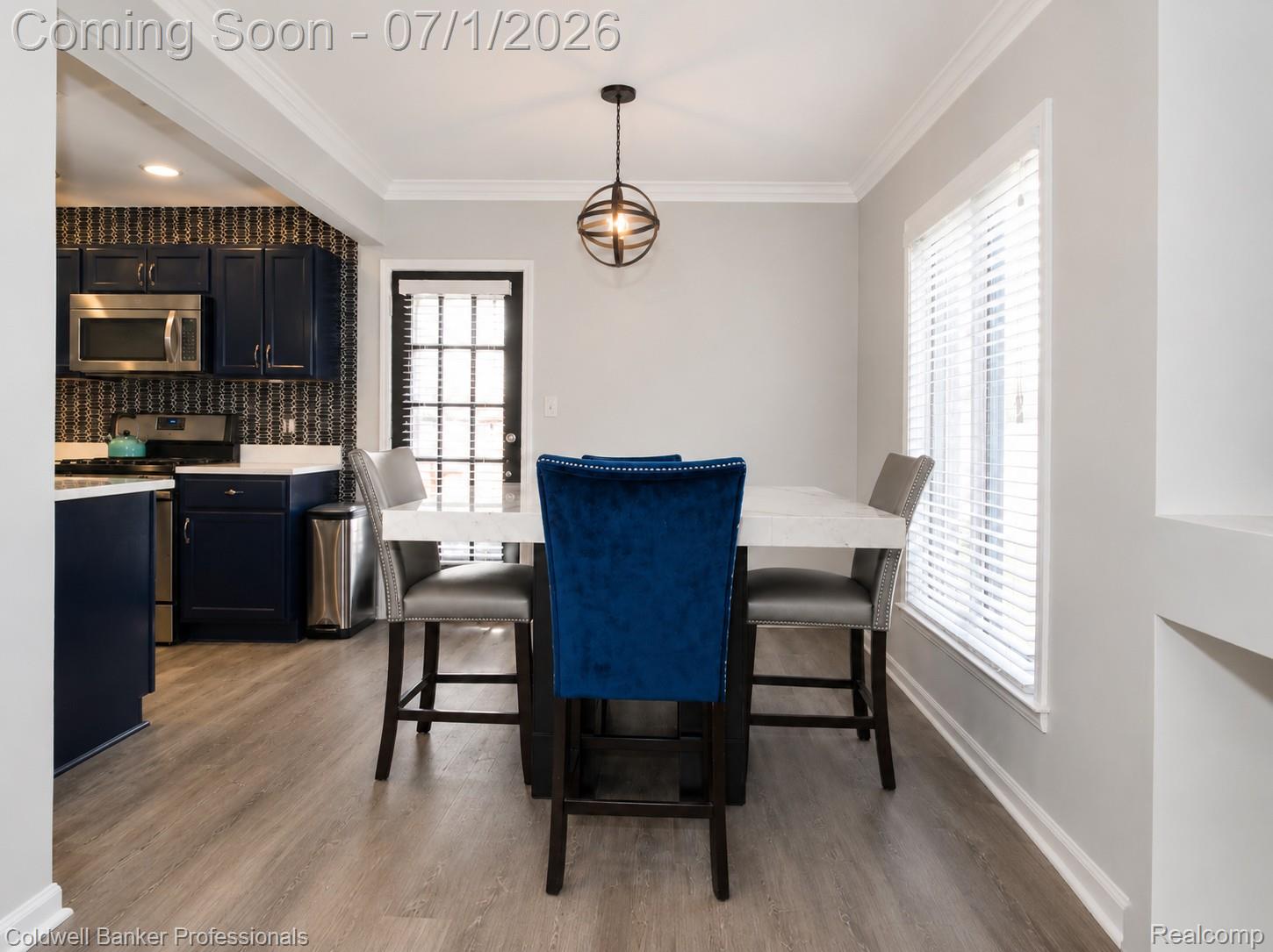 1168 Vernier Road Grosse Pointe, MI 48236 - Photo 14 of 32 Dining area with wood-finish flooring and crown molding