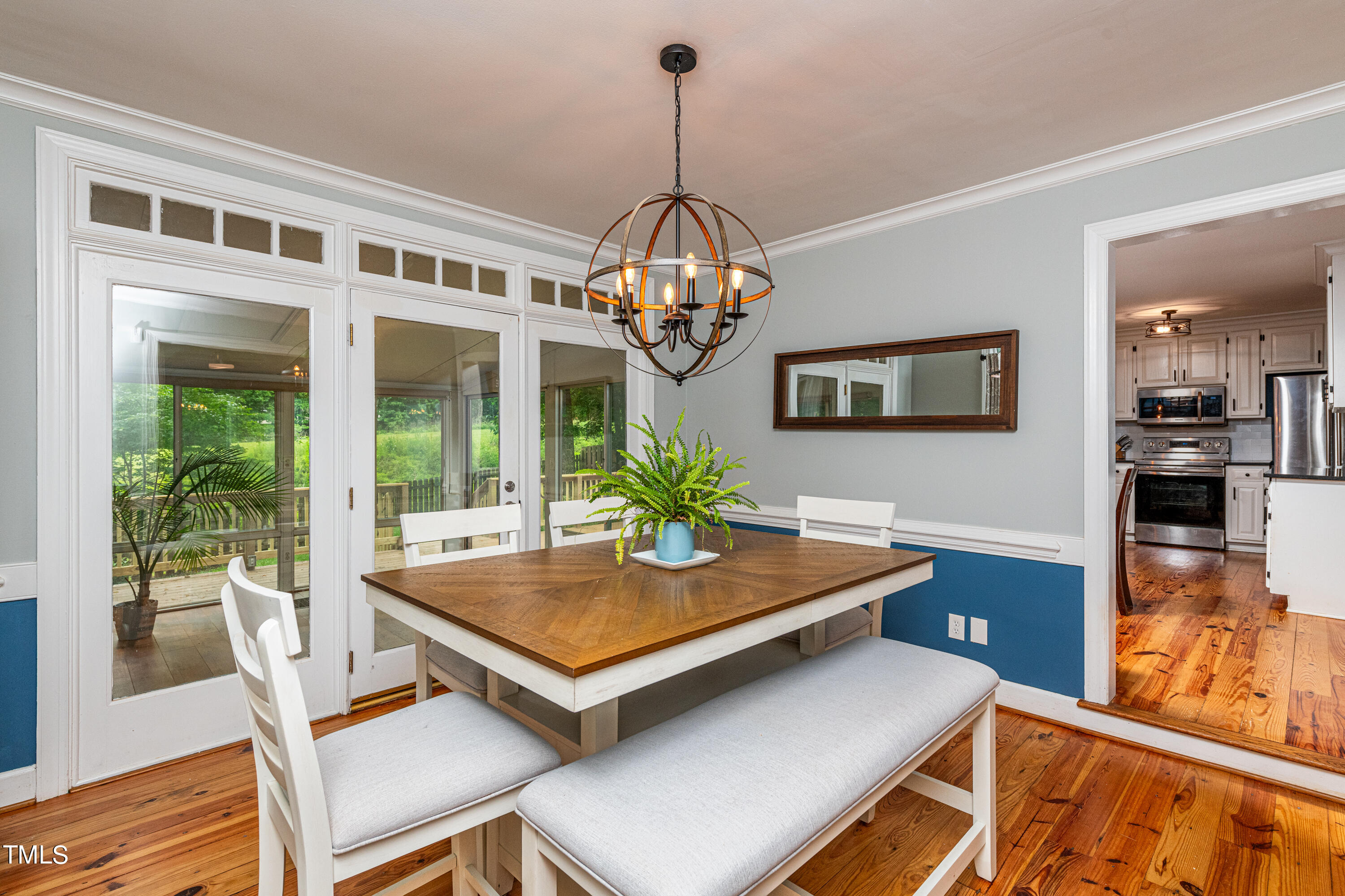 804 Kings Cross Way Raleigh, NC 27615 - Photo 8 of 40 a view of a dining room with furniture wooden floor and chandelier