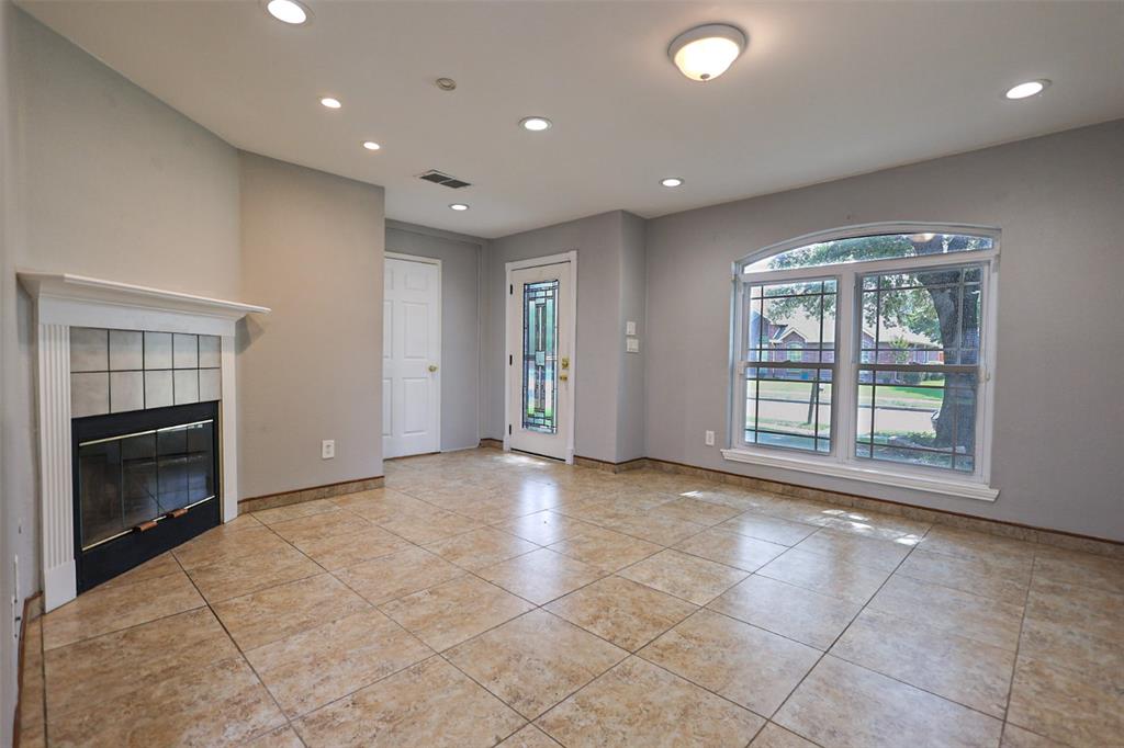 815 Valleycreek Road Mesquite, TX 75181 - Photo 2 of 31 a view of an empty room with a fireplace and a window