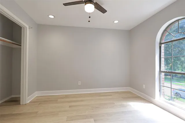 a view of an empty room with a window