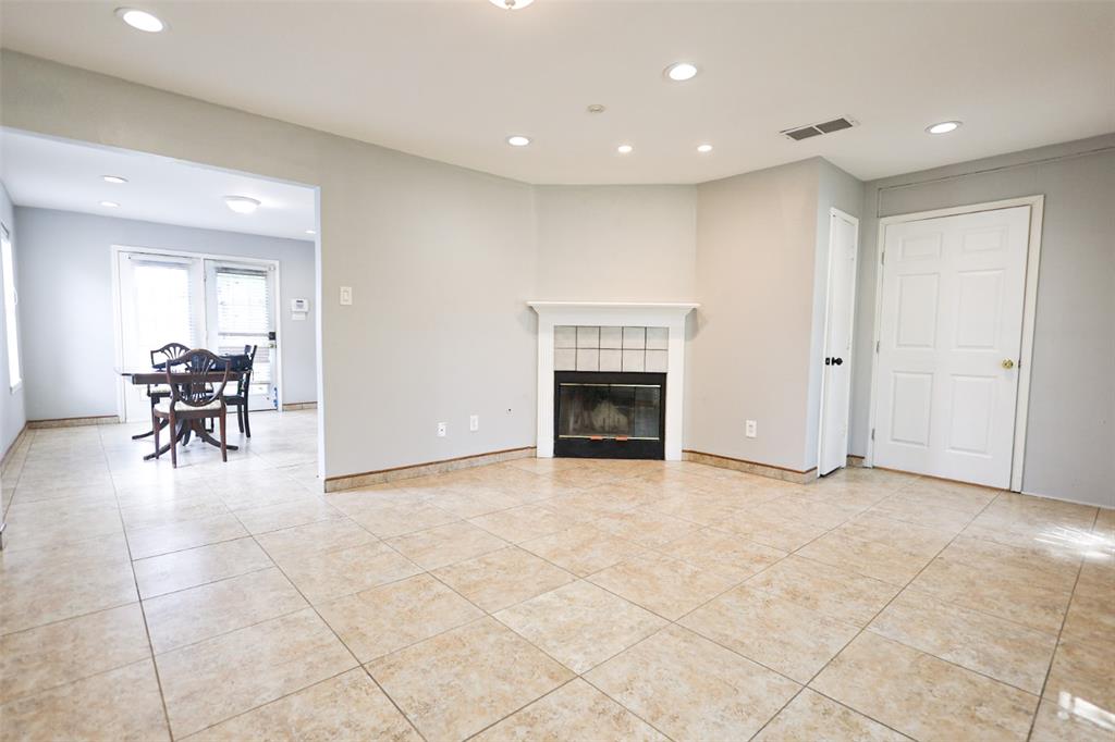 815 Valleycreek Road Mesquite, TX 75181 - Photo 3 of 31 a view of livingroom with dining area a fireplace and a window