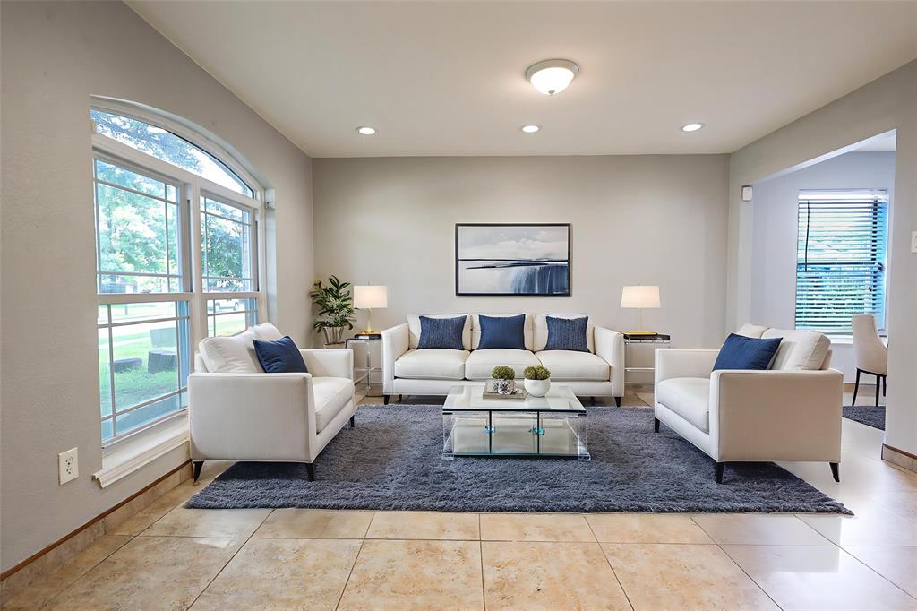 815 Valleycreek Road Mesquite, TX 75181 - Photo 5 of 31 a living room with fireplace furniture and a large window
