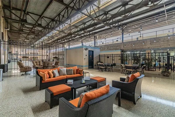 a table and chairs in front of a building