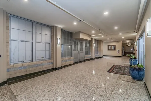 a view of an empty room with a glass door