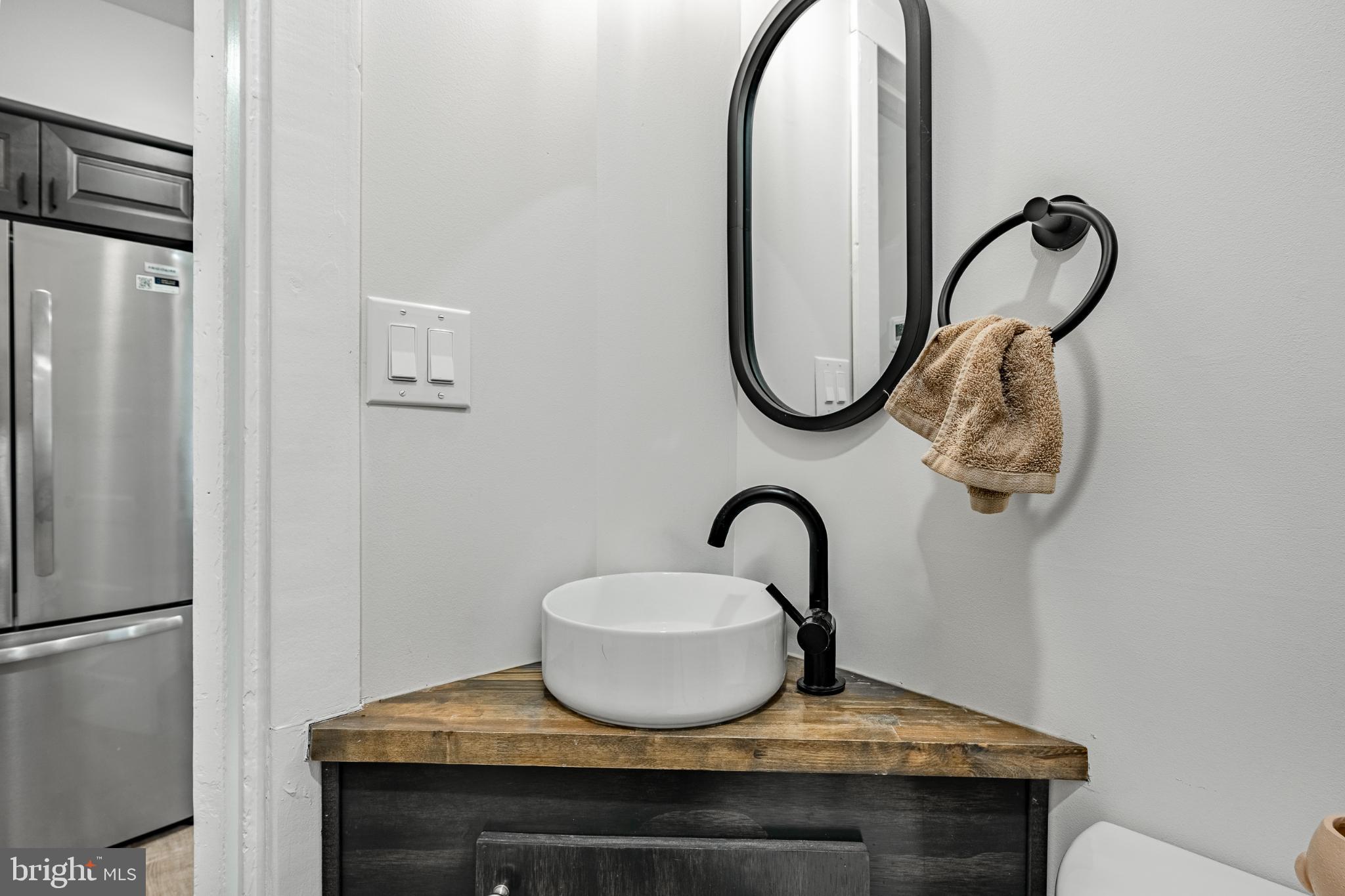 324-326 Darby Road, Unit 1R Havertown, PA 19083 - Photo 12 of 17 Sleek corner sink with modern accents.