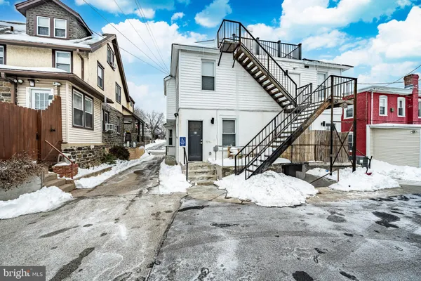 a view of a house with wooden stairs