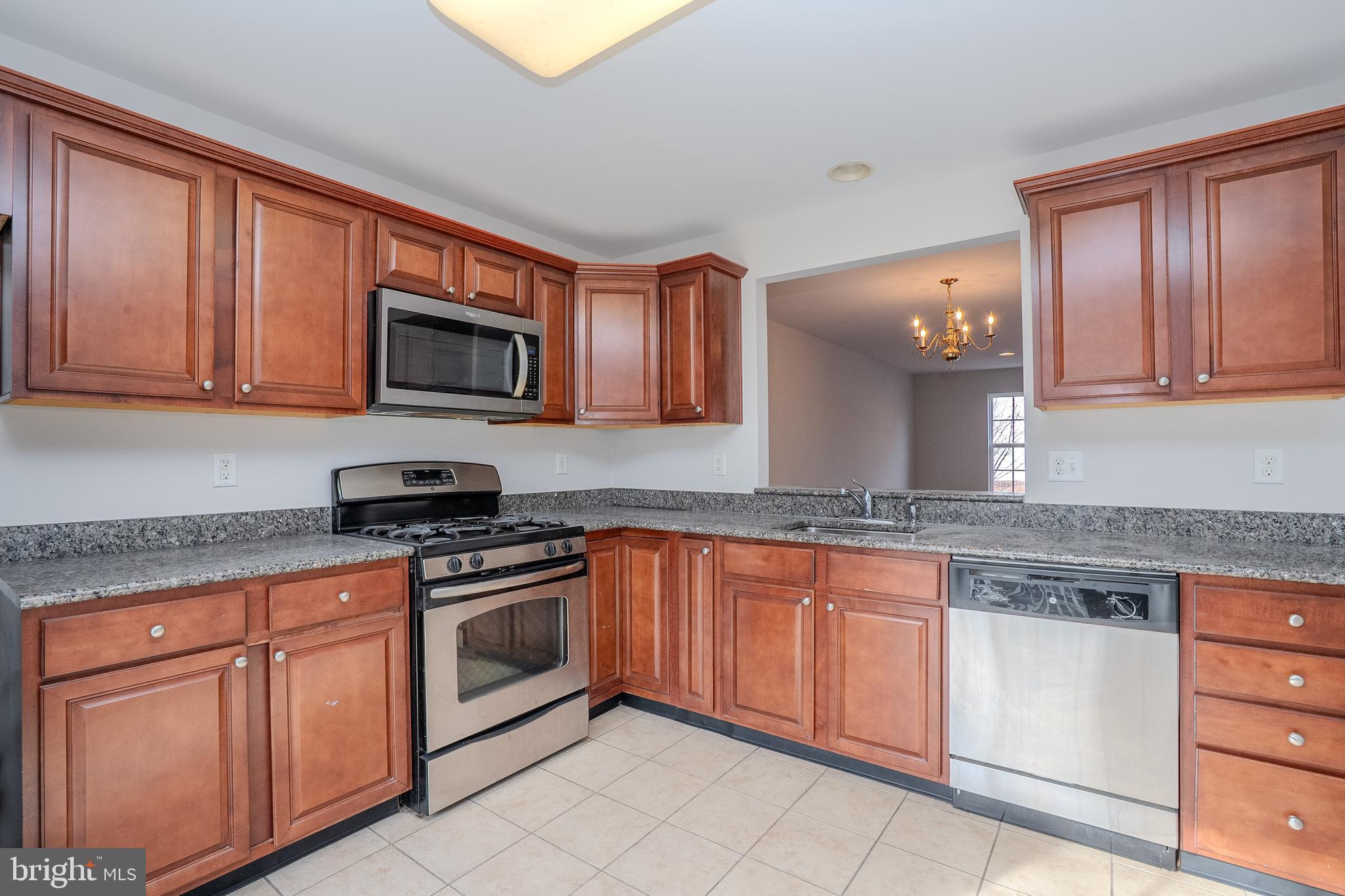 5 Rafting Way Trenton, NJ 08611 - Photo 2 of 26 a kitchen with granite countertop cabinets stainless steel appliances and a counter space