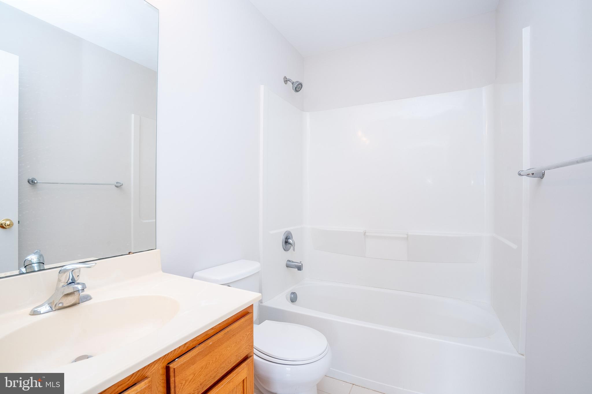 5 Rafting Way Trenton, NJ 08611 - Photo 23 of 26 a bathroom with a bathtub shower sink vanity and toilet
