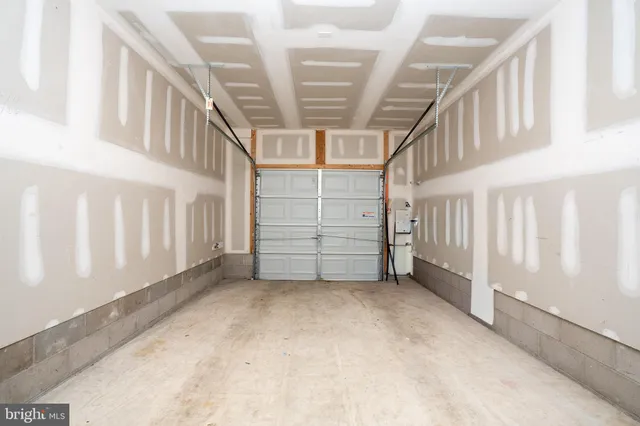 a view of an empty room with stairs