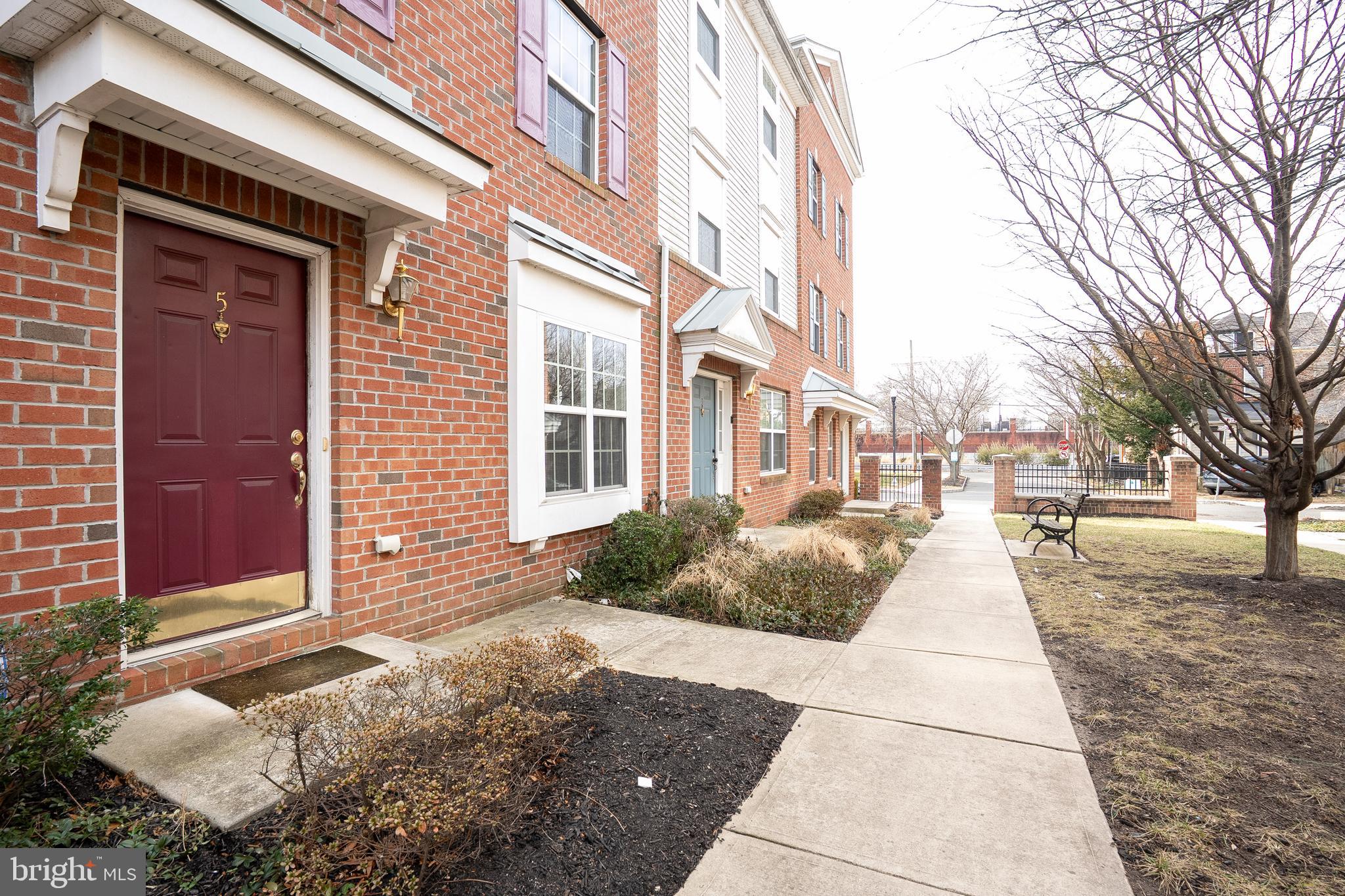 5 Rafting Way Trenton, NJ 08611 - Photo 25 of 26 a view of a brick house with many windows