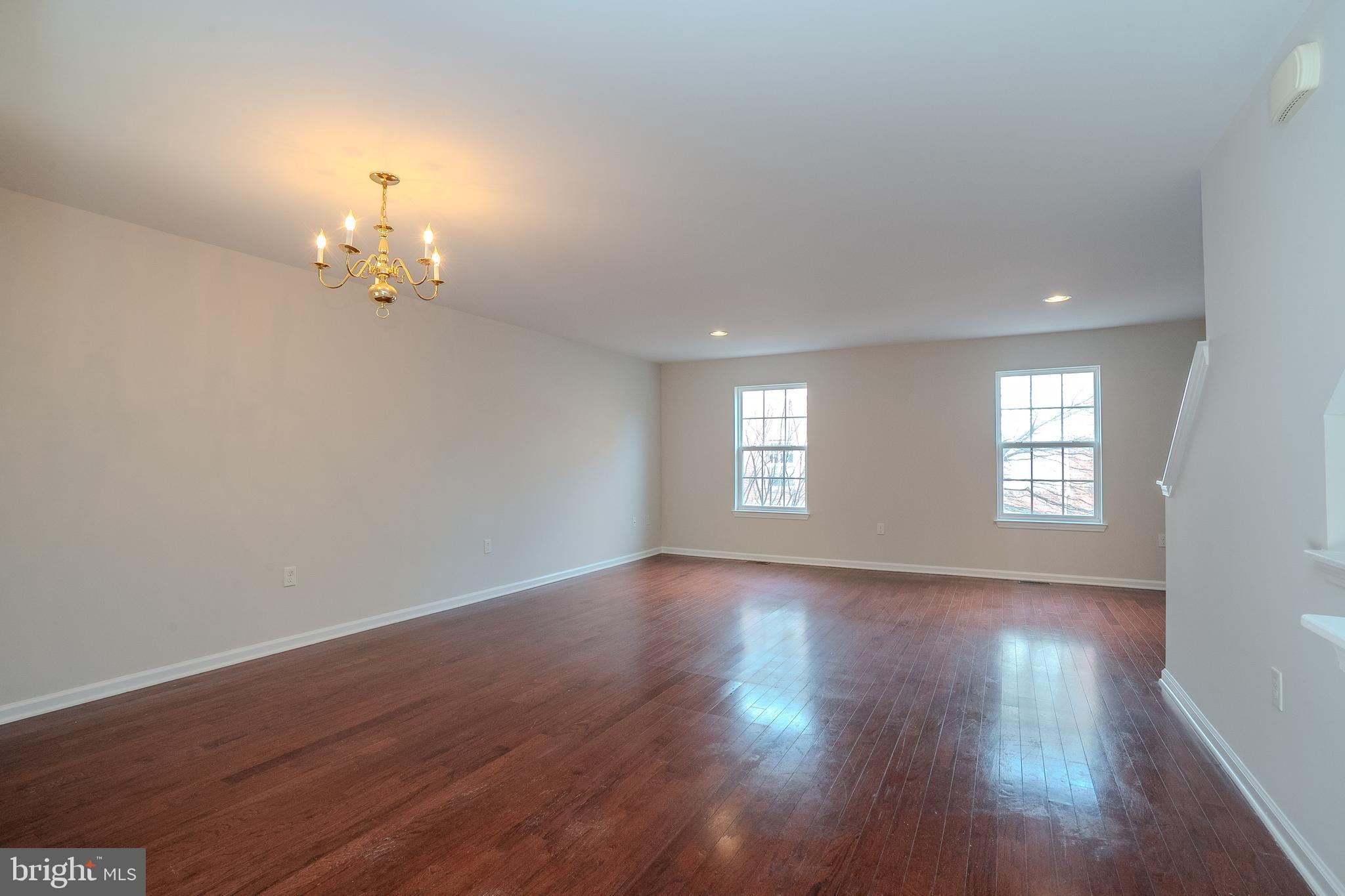 5 Rafting Way Trenton, NJ 08611 - Photo 6 of 26 an empty room with wooden floor and window