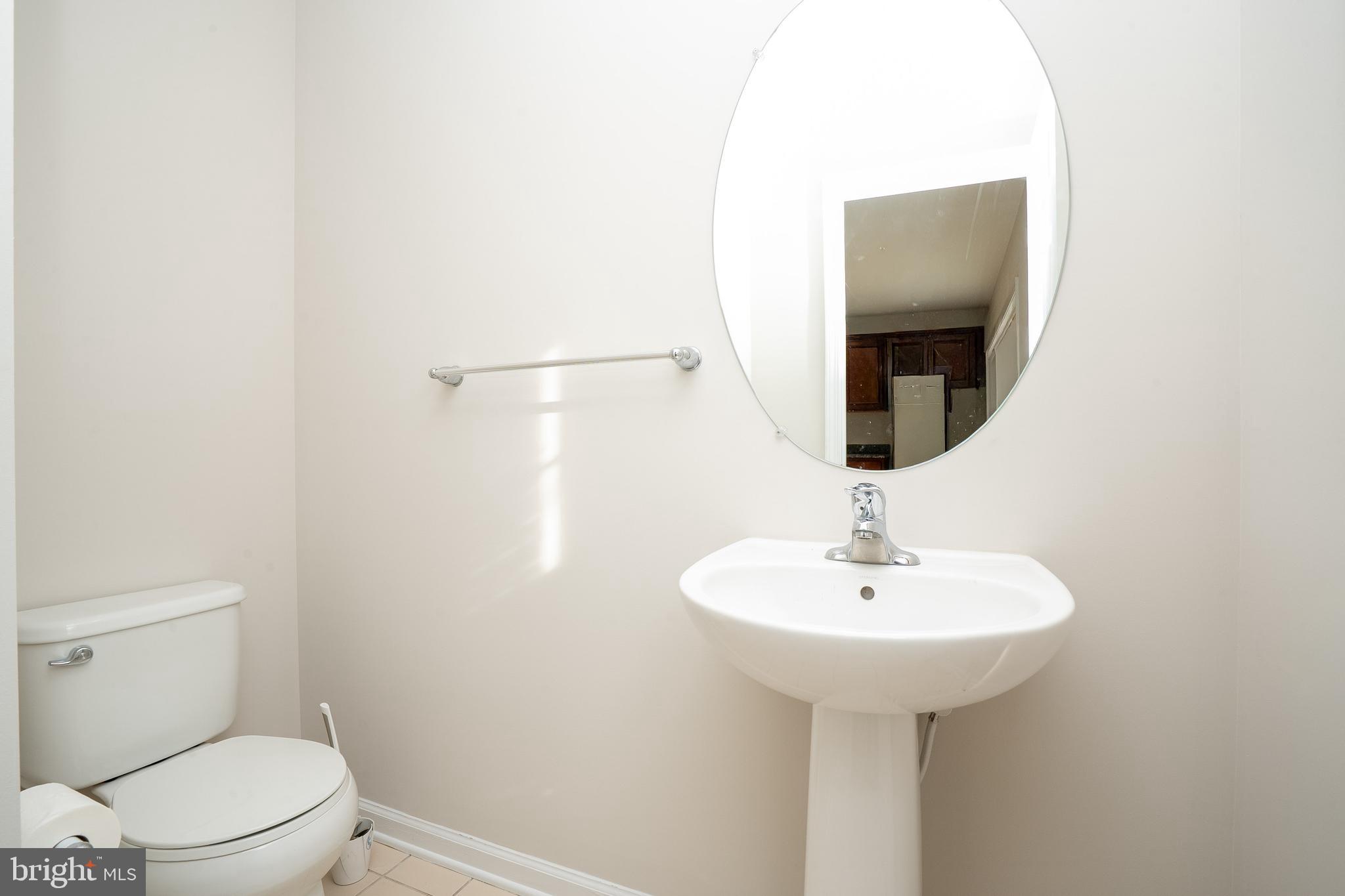 5 Rafting Way Trenton, NJ 08611 - Photo 9 of 26 a bathroom with a sink toilet and a mirror
