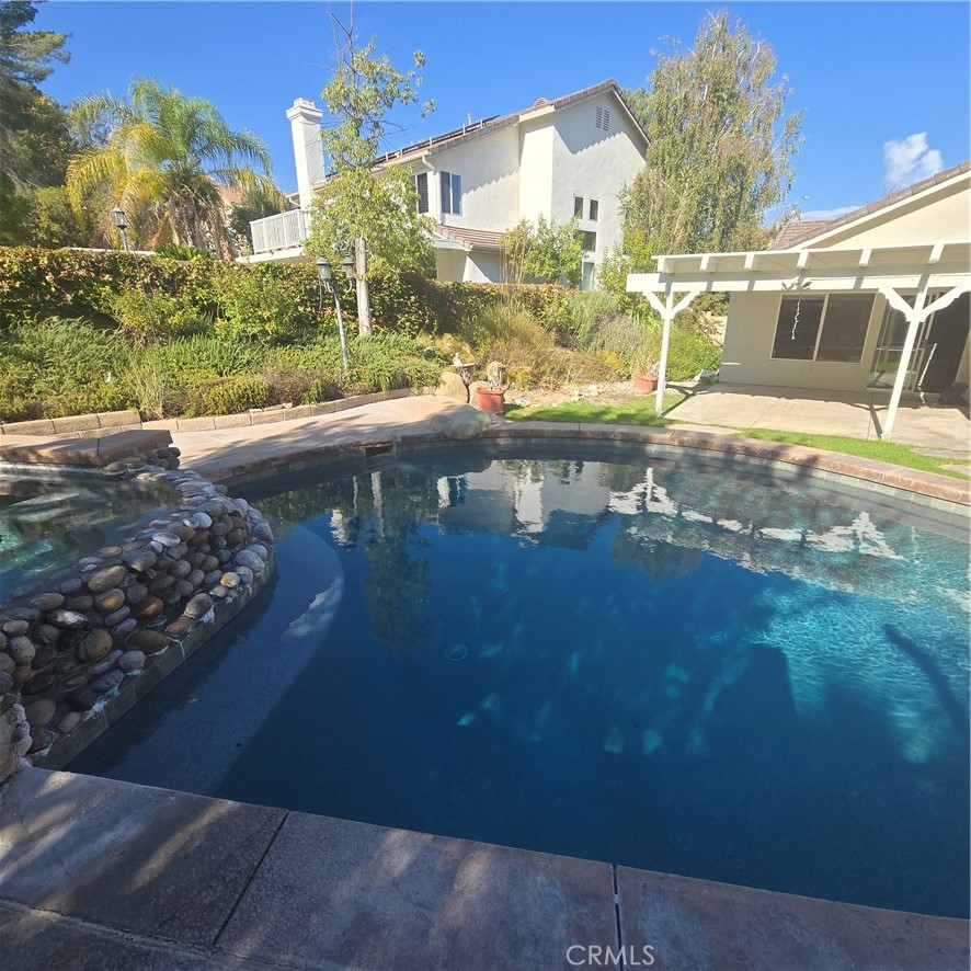 a view of a balcony with a yard