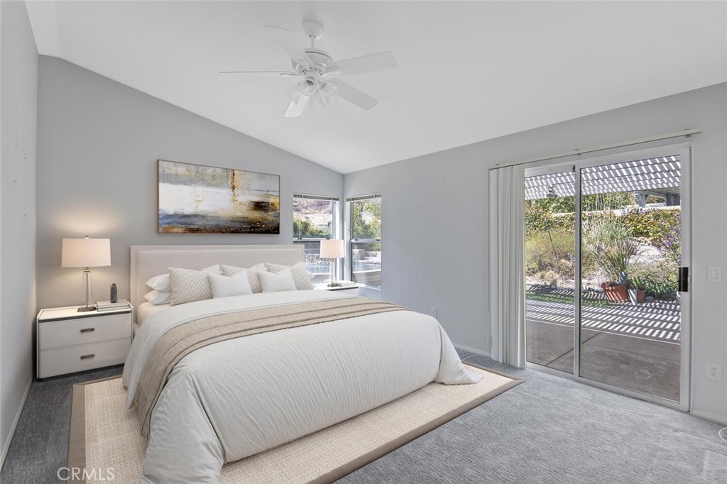 27619-27619 Ron Ridge Drive Saugus, CA 91350 - Photo 17 of 37 a bedroom with a large bed and a tv