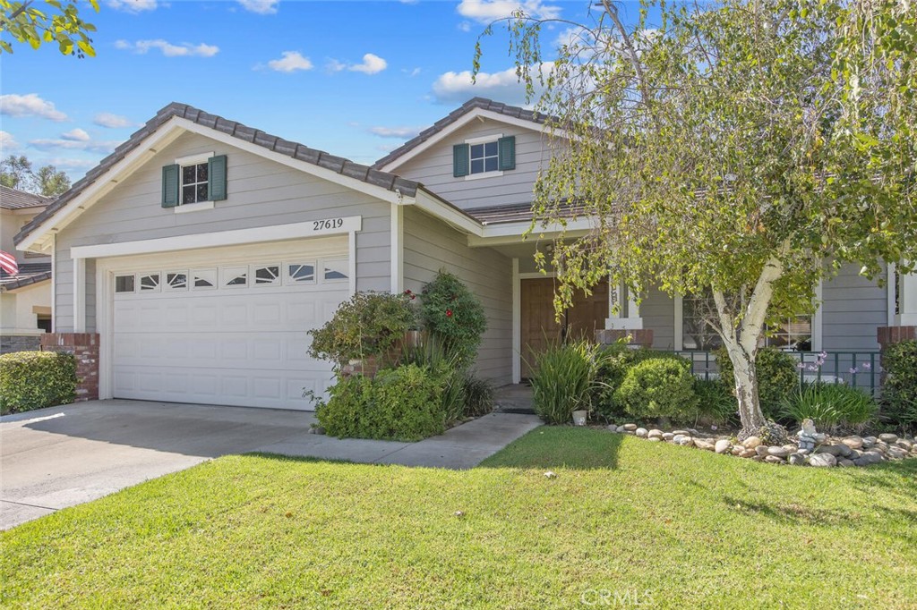 27619-27619 Ron Ridge Drive Saugus, CA 91350 - Photo 2 of 37 a front view of house with yard and green space