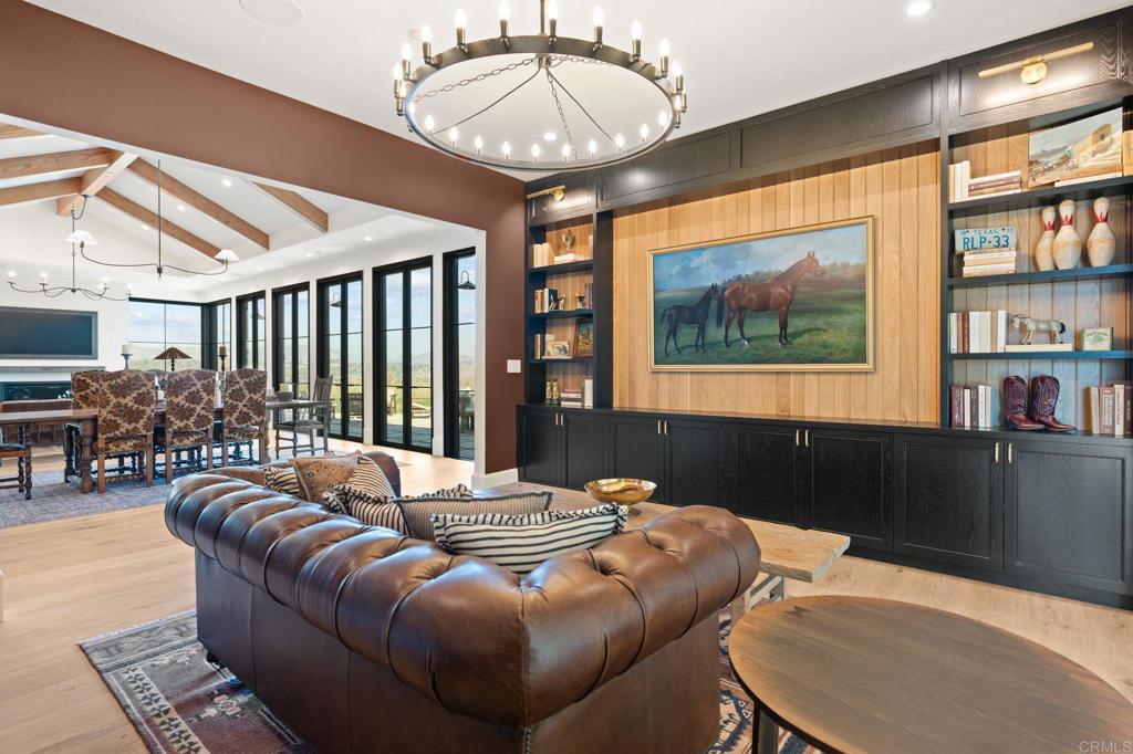15816 Via Del Alba Rancho Santa Fe, CA 92067 - Photo 18 of 50 a living room with furniture a large window and a chandelier