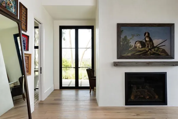a bathroom with a granite countertop sink a mirror and cabinets