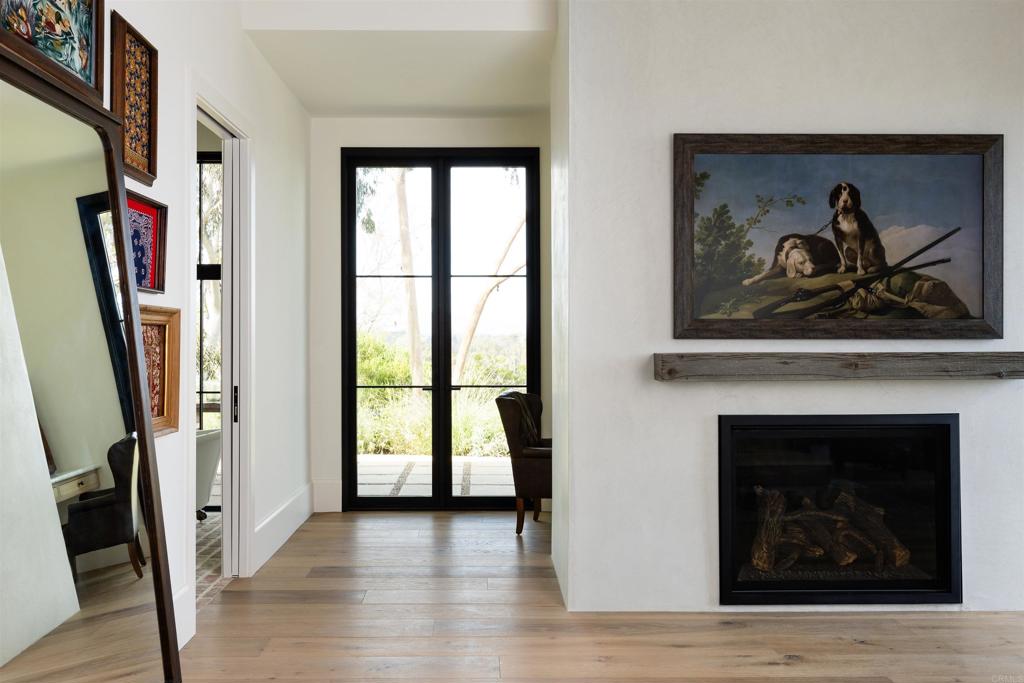 15816 Via Del Alba Rancho Santa Fe, CA 92067 - Photo 24 of 50 a view of a livingroom with wooden floor and a fireplace
