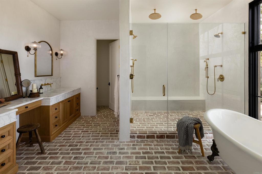 15816 Via Del Alba Rancho Santa Fe, CA 92067 - Photo 27 of 50 a bathroom with a double vanity sink a mirror and a bathtub
