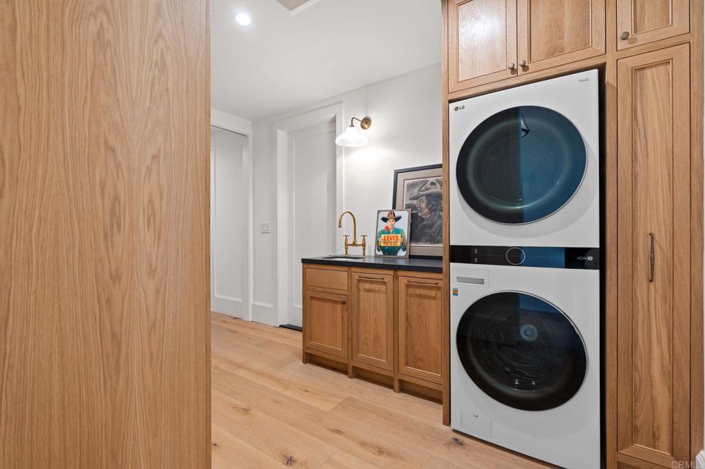 15816 Via Del Alba Rancho Santa Fe, CA 92067 - Photo 32 of 50 a view of a hallway with washer and dryer