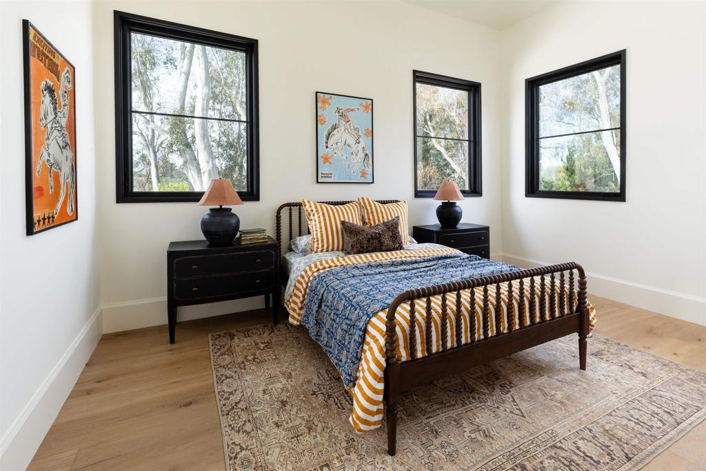 15816 Via Del Alba Rancho Santa Fe, CA 92067 - Photo 33 of 50 a bedroom with a bed and a window with outer view