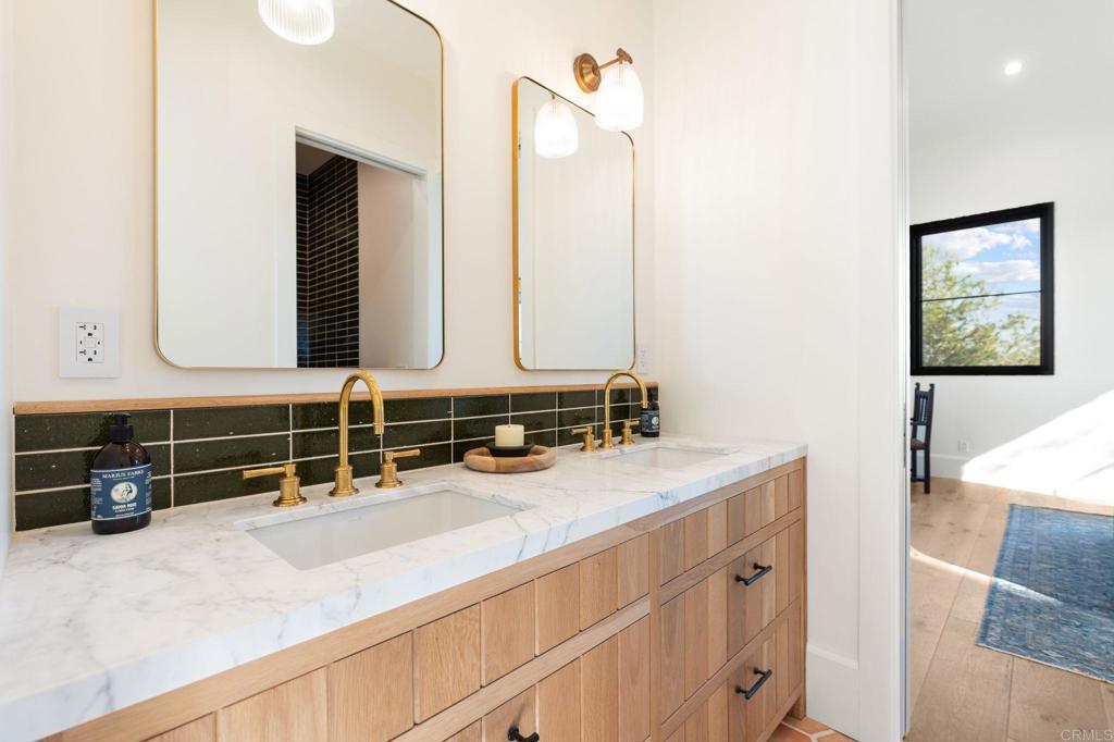 15816 Via Del Alba Rancho Santa Fe, CA 92067 - Photo 34 of 50 a bathroom with a sink and a mirror