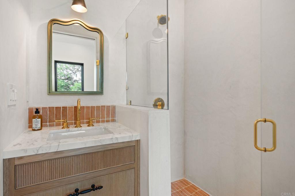 15816 Via Del Alba Rancho Santa Fe, CA 92067 - Photo 36 of 50 a bathroom with a sink a mirror and vanity