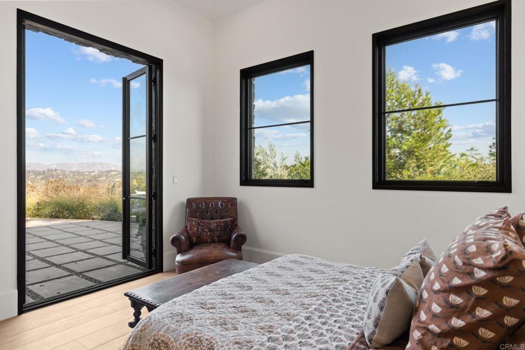 15816 Via Del Alba Rancho Santa Fe, CA 92067 - Photo 38 of 50 a bedroom with a bed and wooden floor