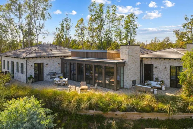 a view of swimming pool with outdoor seating and plants